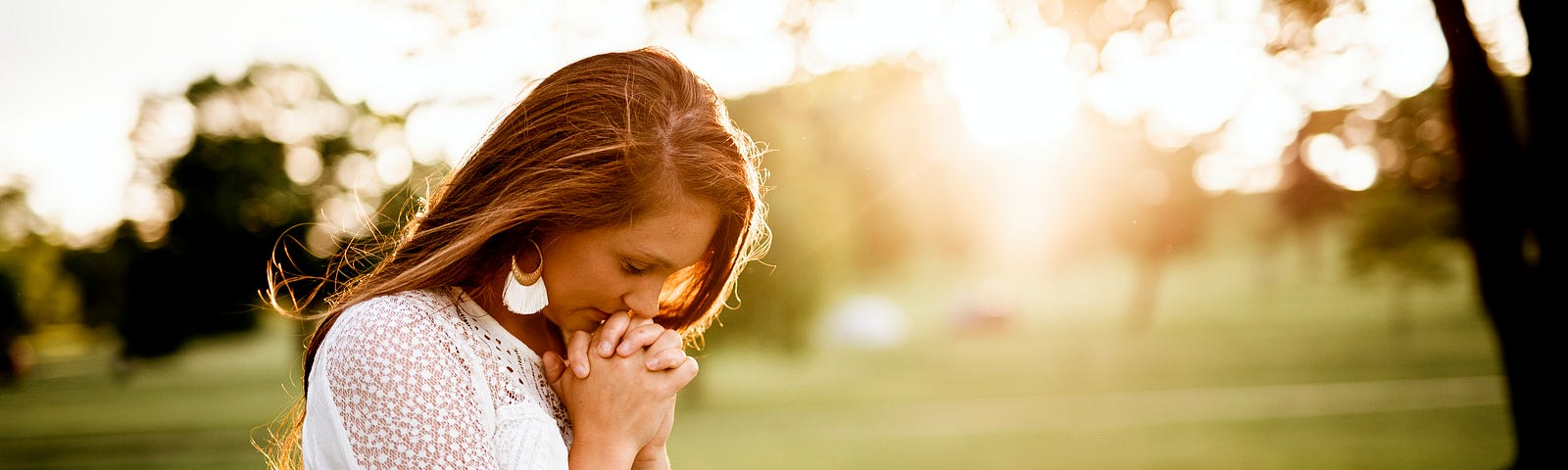 A lady on a summers evening praying