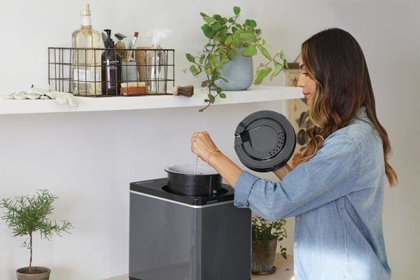 A woman using the Vitamix FoodCycler FC-50