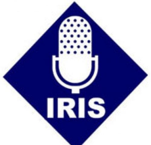A white microphone on a blue background with the word “IRIS” under the microphone