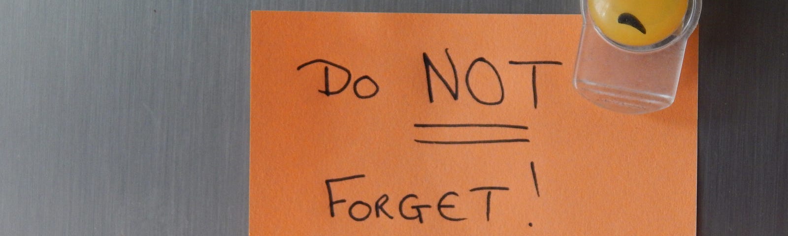 smiley face magnet on paper that says DO NOT FORGET