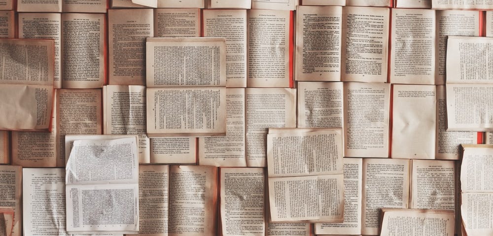 Various books spread over a table