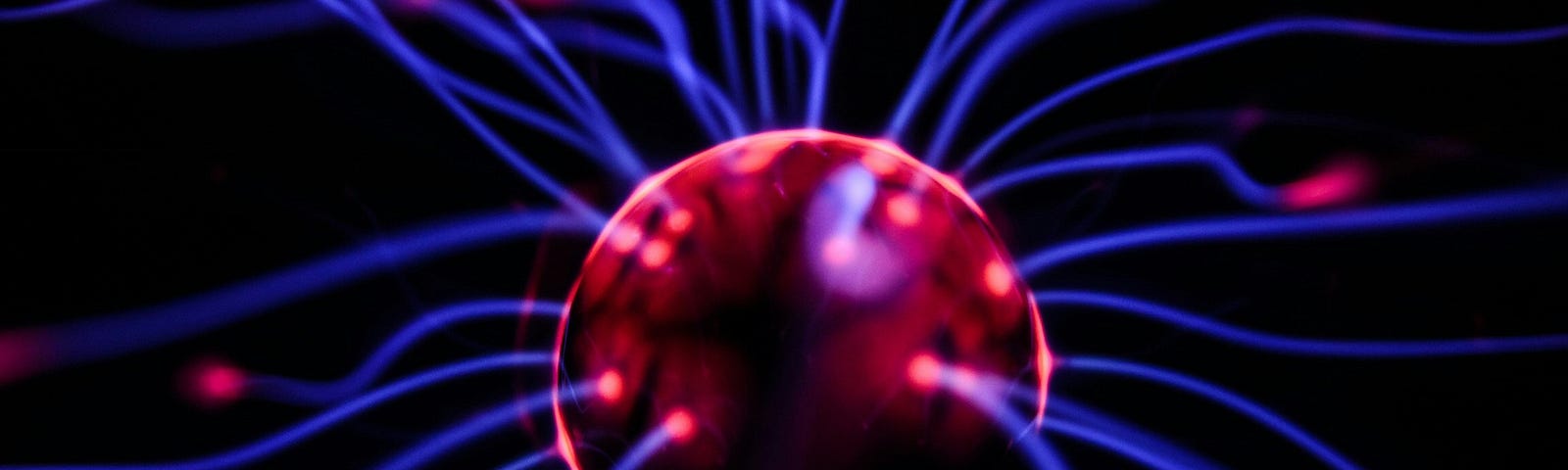 A red ball with blue plasma lights around