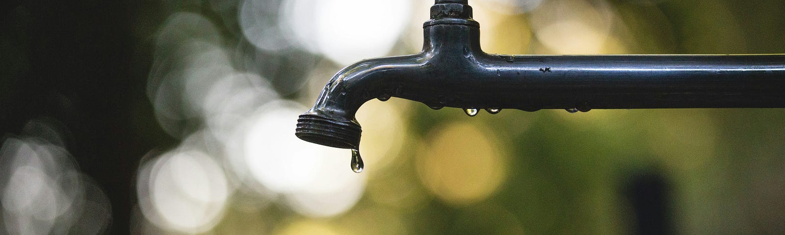 water tap with one drop of water