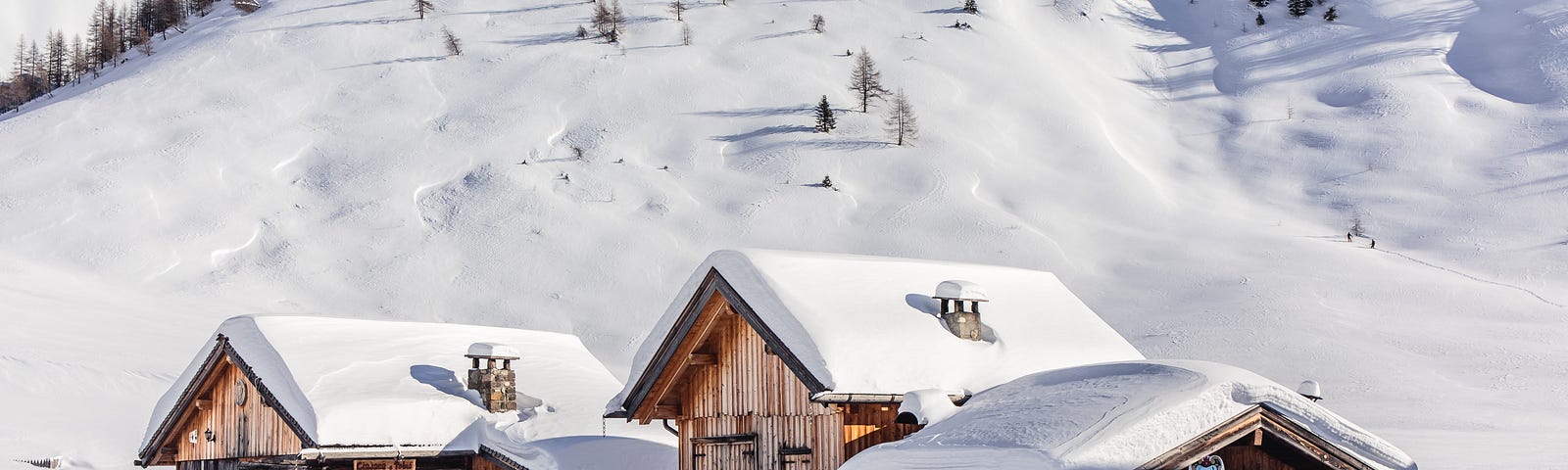 wooden chalets in the snow