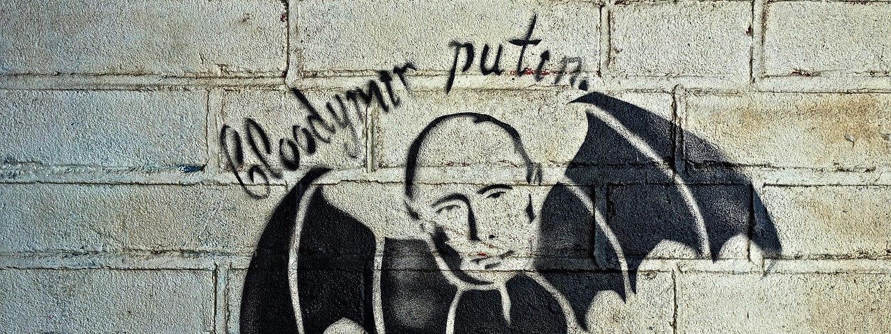 IMAGE: A grafitti with Putin’s head on the body of a bat, and with the inscription “Bloodymir Putin”