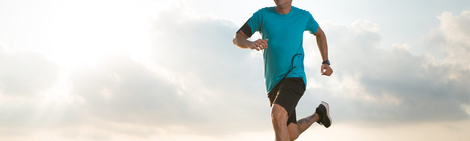 Man running by the sea.