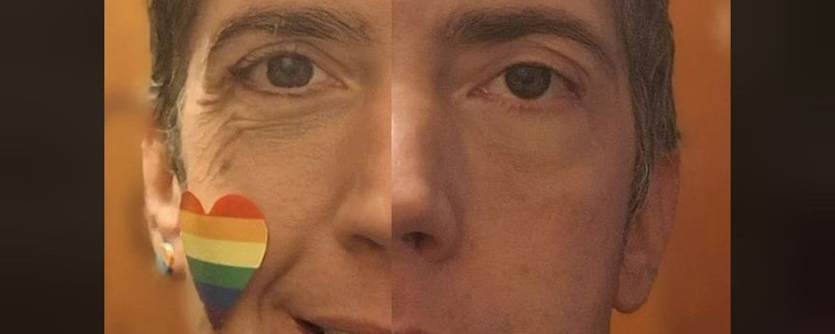Selfie with rainbow heart sticker on cheek. Two pics spliced together: Half of face is smiling, half is frowning.