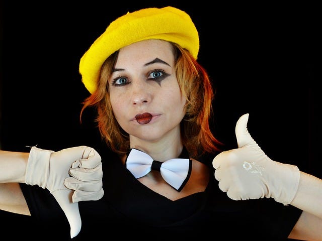 Thumb up or thumb down, yes/no, girl in yellow beret as mime artist