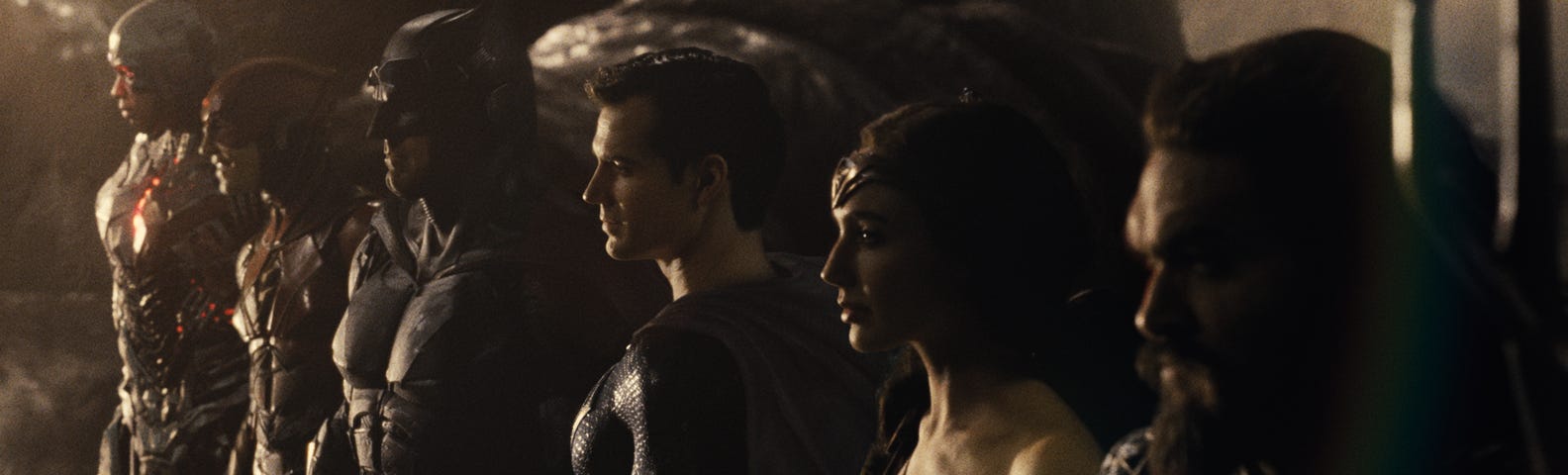 (L-R) Ray Fisher, Ezra Miller, Ben Affleck, Henry Cavill, Gal Gadot, and Jason Momoa in a still from “Zack Snyder’s Justice League” (2021), a film directed by Zack Snyder, and released on HBO Max. Courtesy WarnerMedia, Warner Bros., and DC Films.