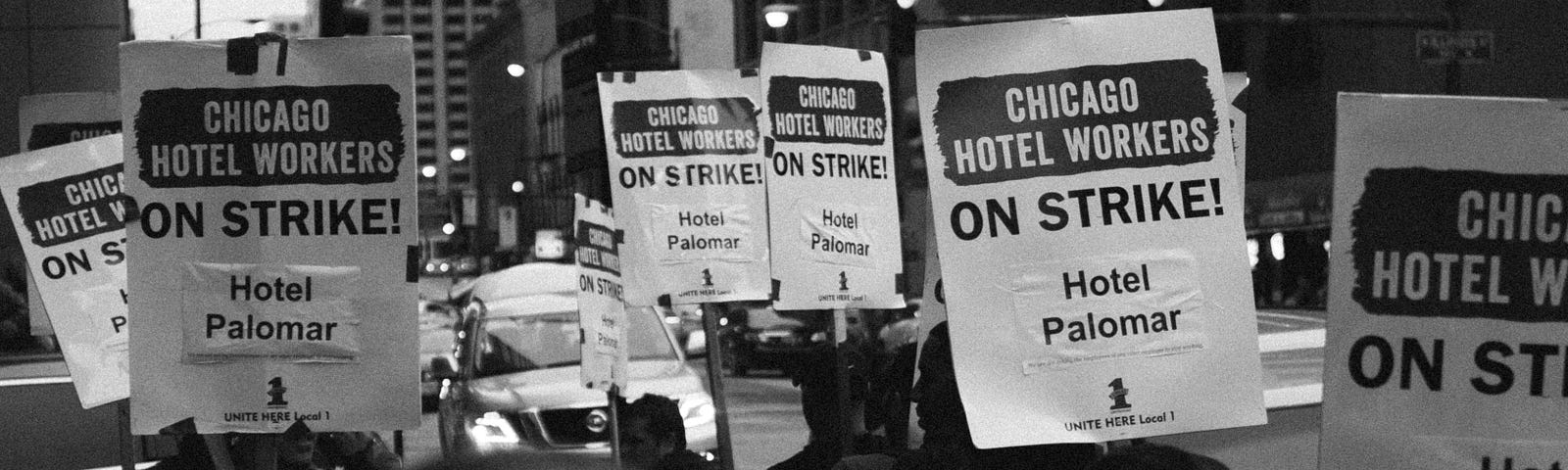 Man stands in front of Chicago Hotel Workers picket line