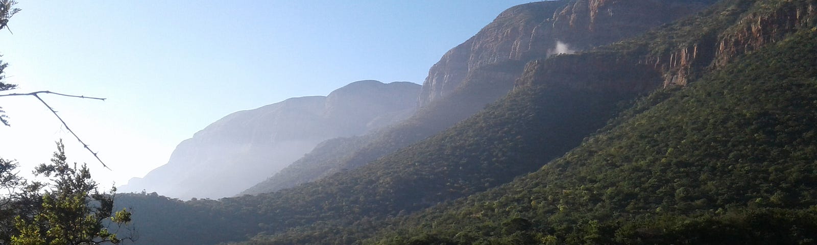 A scenic mountain range in the early morning