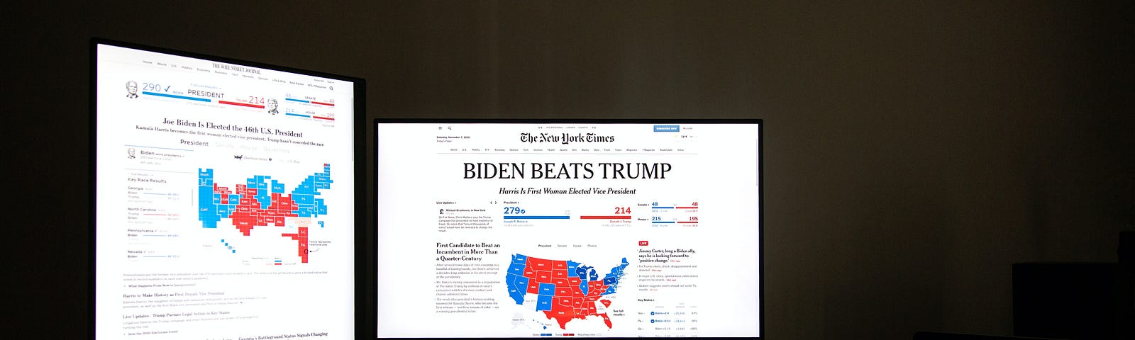 Two computer screens with headlines announcing Biden’s win