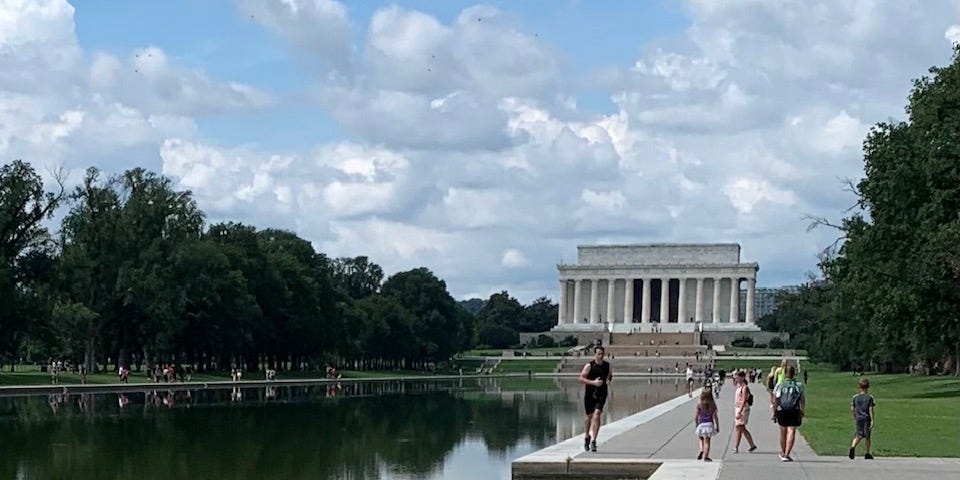 the Lincoln Memorial and reflecting pool at a distance on a summer day