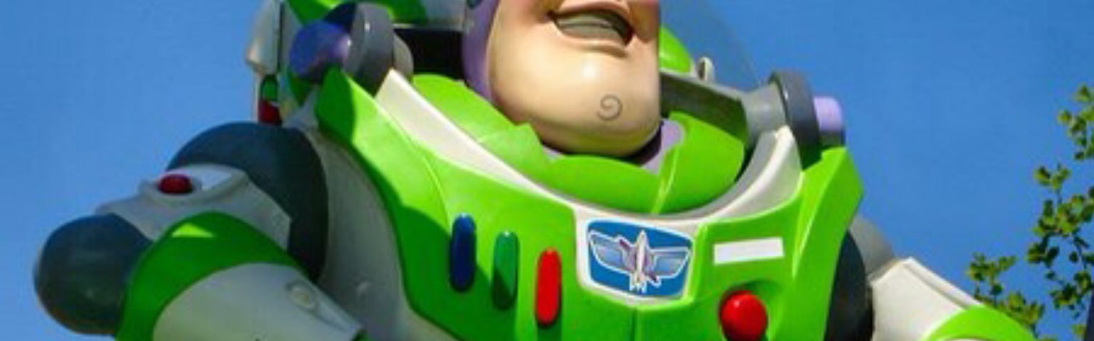 Disney toy, Buzz Lightyear, from the waist up, looking forward.