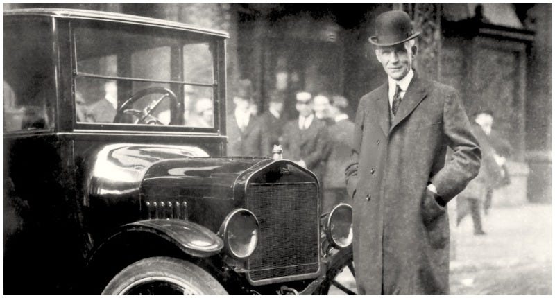 Henry Ford, posing with his Ford car. Credits: Vintage News