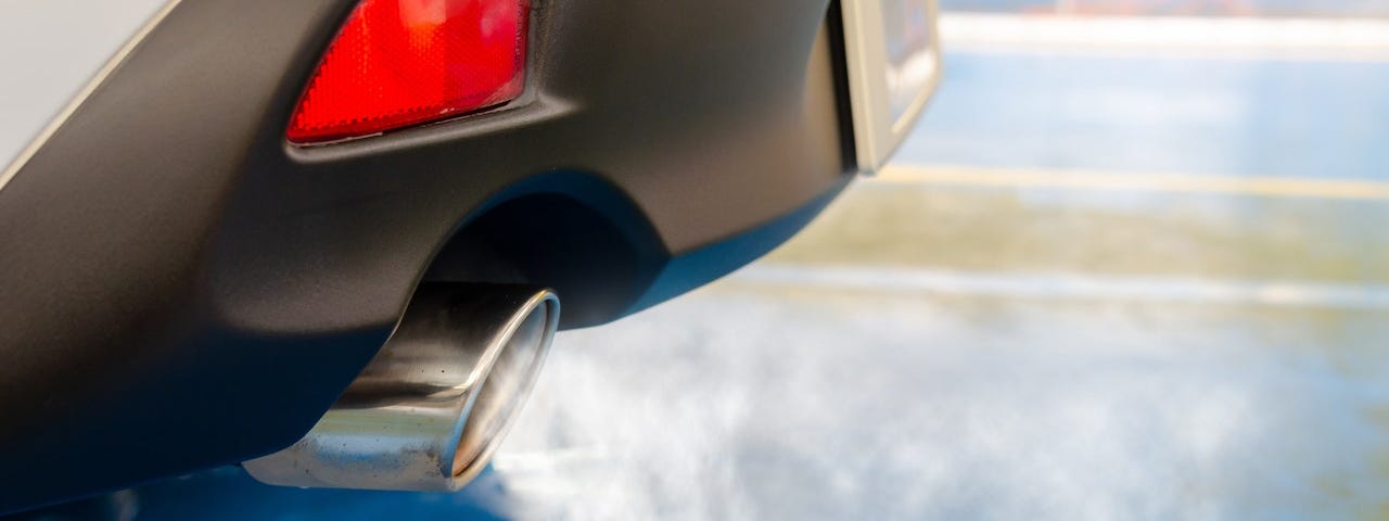 IMAGE: A car exhaust pipe expelling toxic fumes