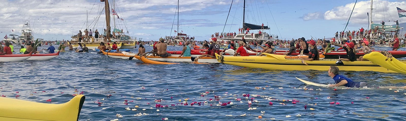 A paddle-out ceremony is held with surfers and boats to commemorate the first anniversary of the Lahaina wildfire, on Maui, Hawaii, August 8, 2024. Photo by Kyodo via Reuters