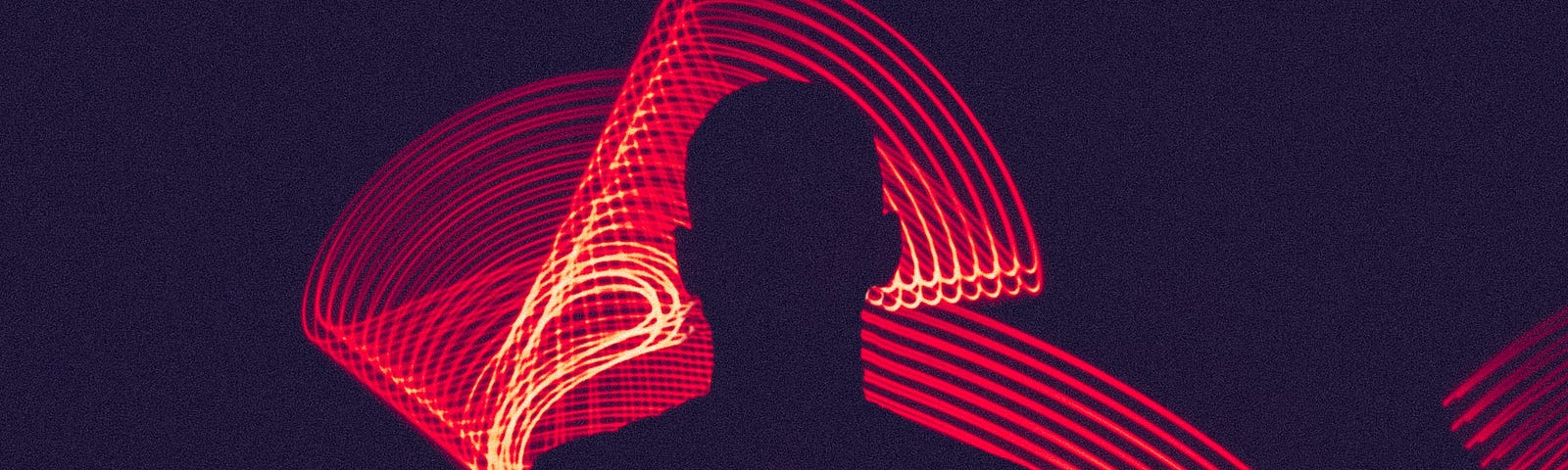 Shadow of a person in the center of the image with lines red neon behind them.