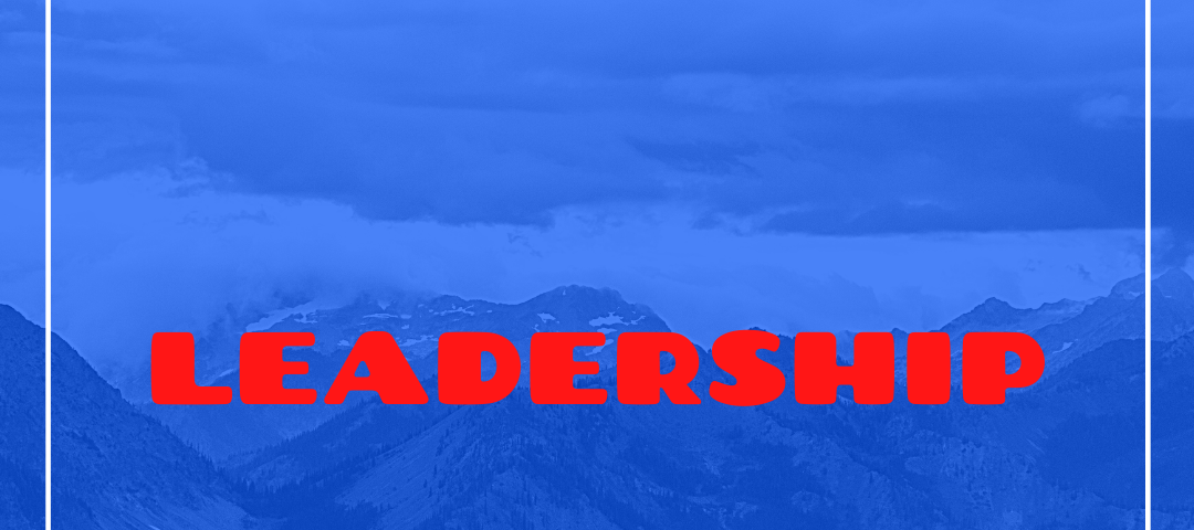 A blue-washed mountain range with the word Leadership in red letters.