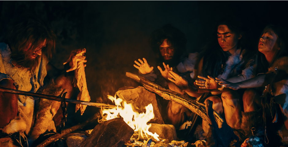 A group of early humans around a fire