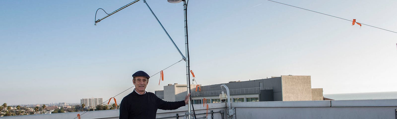 RAND researcher Robert Lempert with the newly installed array of data-generating sensors on the roof of RAND’s Santa Monica headquarters. Photo by Diane Baldwin/RAND Corporation