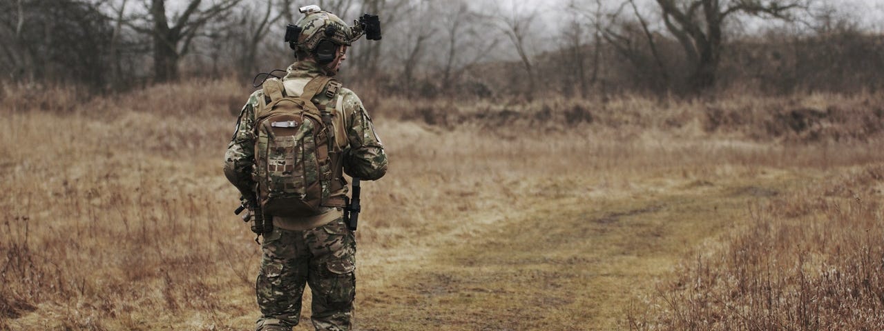 Soldier wearing uniform and walking alone