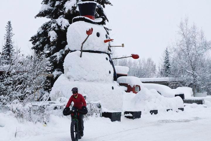 Photo of giant snowman in Alaska called Snowzilla. Satire. Humor. Winter. Weather. Blizzards. Skiing.