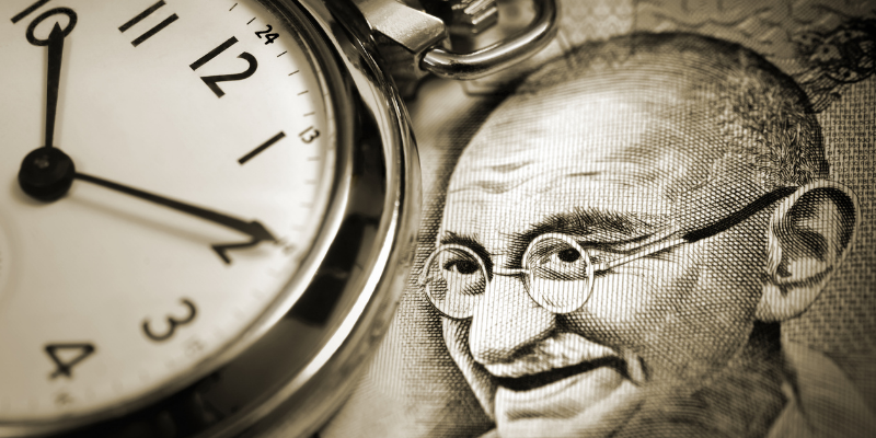 A picture of Gandhi and a clock — Gandhi’s Only Poem Contains a Secret to an Effortless Life