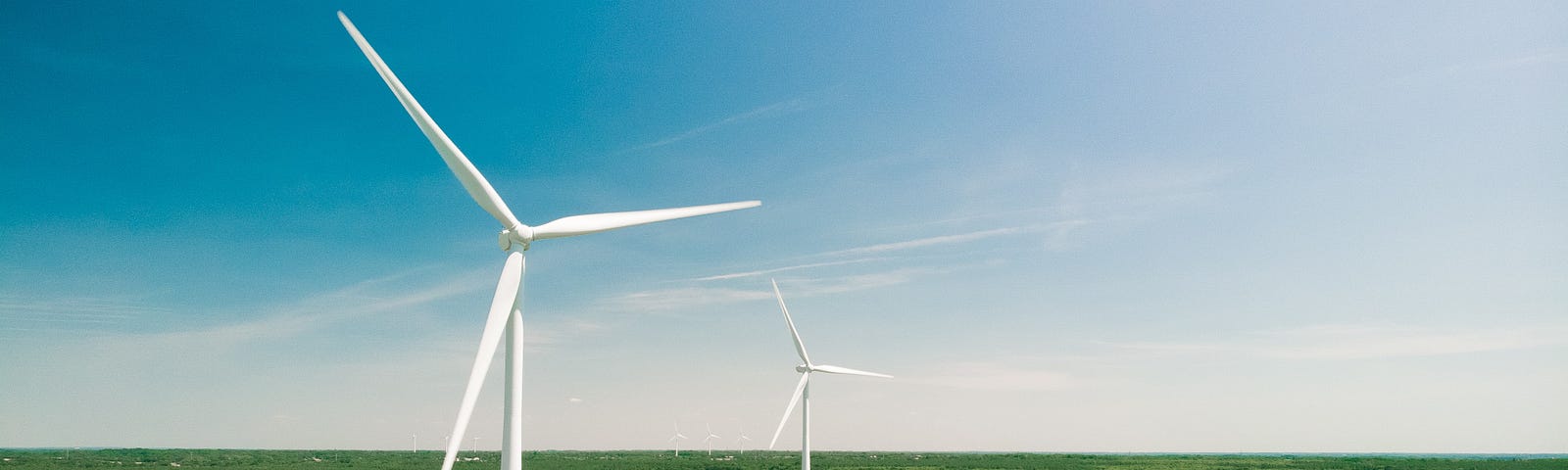 Aerial view of wind turbines and agriculture field