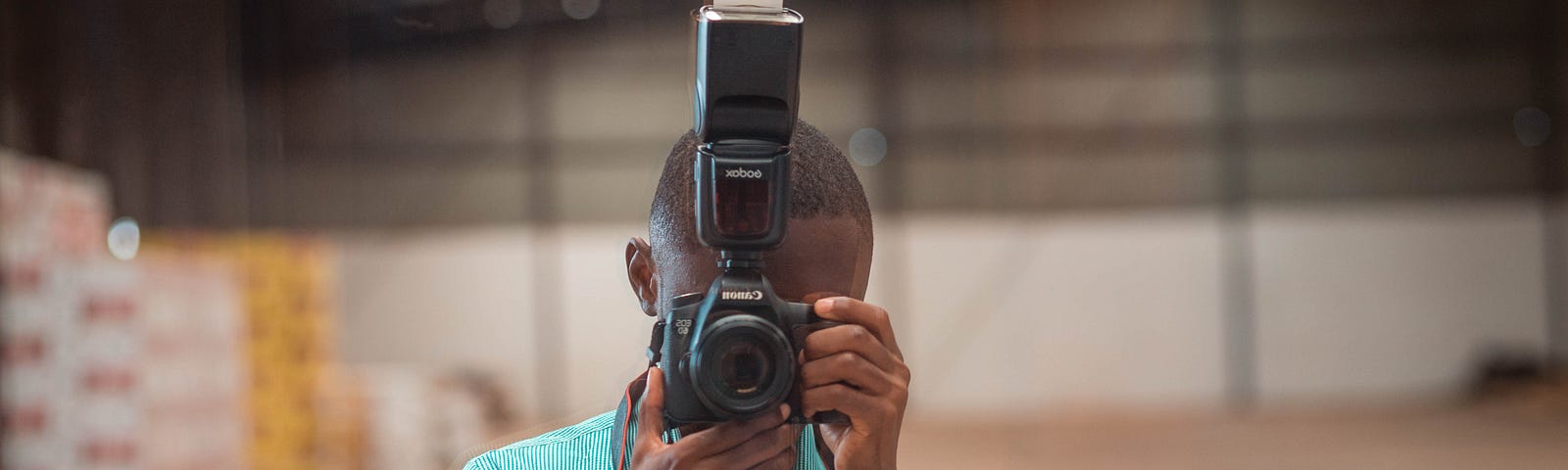 Shot of Boateng Sekyere looking through a camera