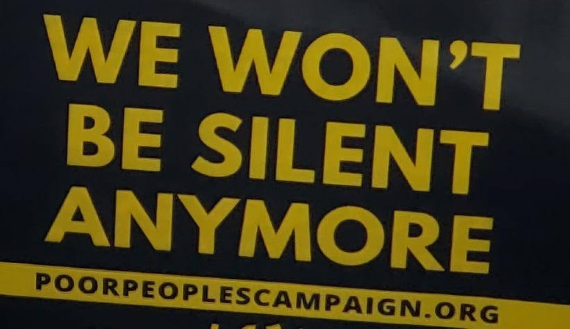 Sign reading “We won’t be silent anymore.”