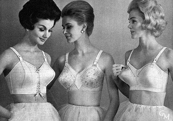 This is probably a Maidenform bra ad from the 1960s. Three women model the bra fashion of that time, pointed bras.