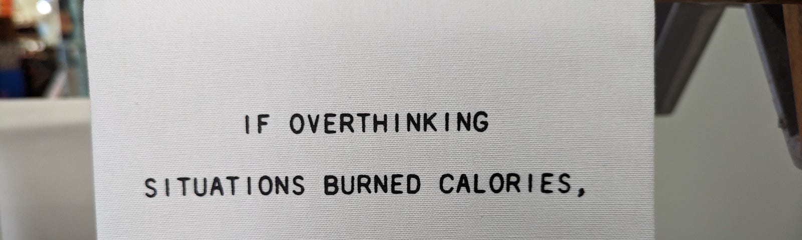Sign reading “If overthinking situations burned calories, I’d be dead.” Wait, human breathing releases CO2!