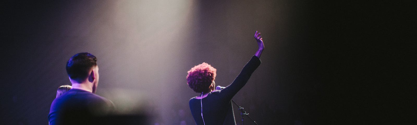 lady singing at microphone