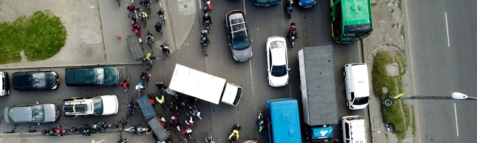 A congested road with cars, bikes and trucks in Bogotá. Colombia