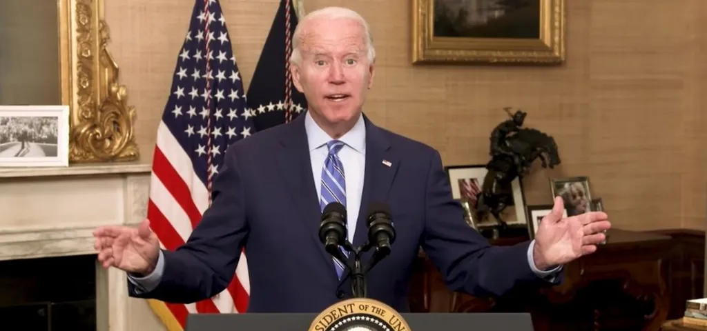 President Joe Biden giving speech in front of podium