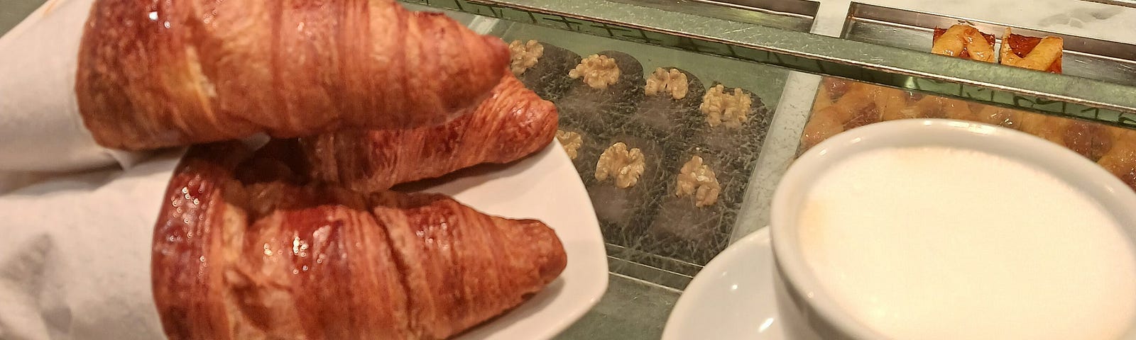 Cappuccino and croissants at a pastry store in Venice