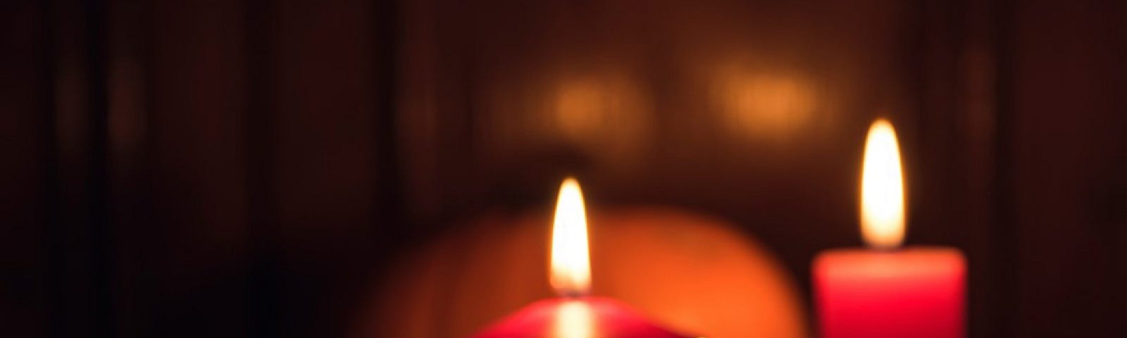 three red candles burning