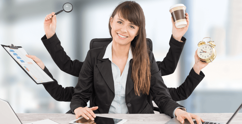 A six-handed designer working with a magnifying glass, a coffee, a watch, a form and a tablet.