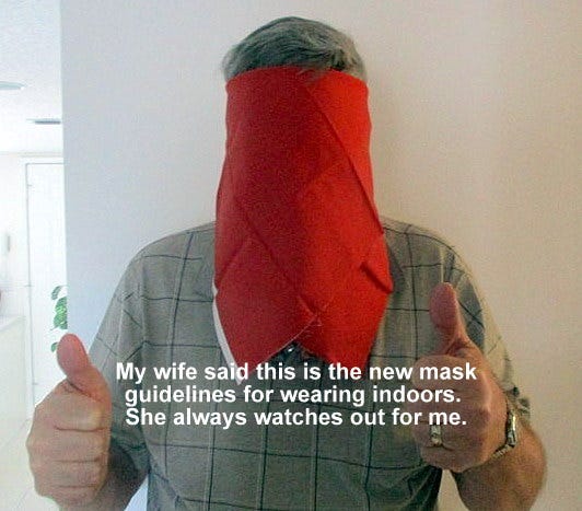 Man in mask covering face. Text on picture says how wife said to wear it this way.