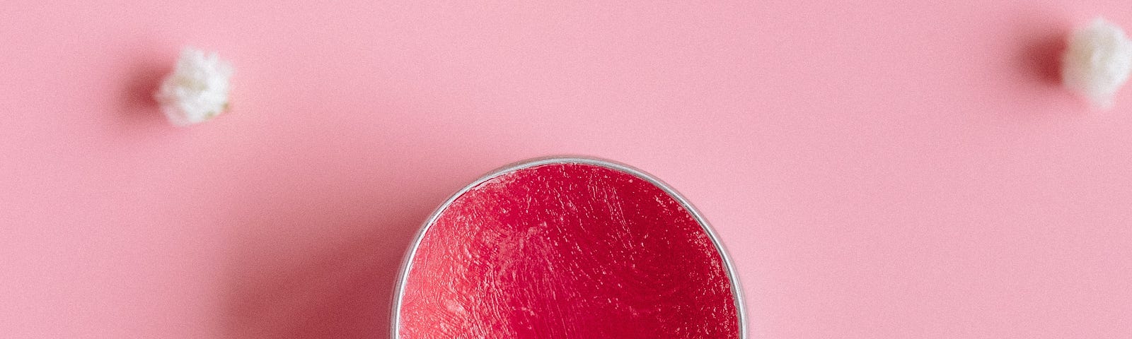 Lip balm with pink background