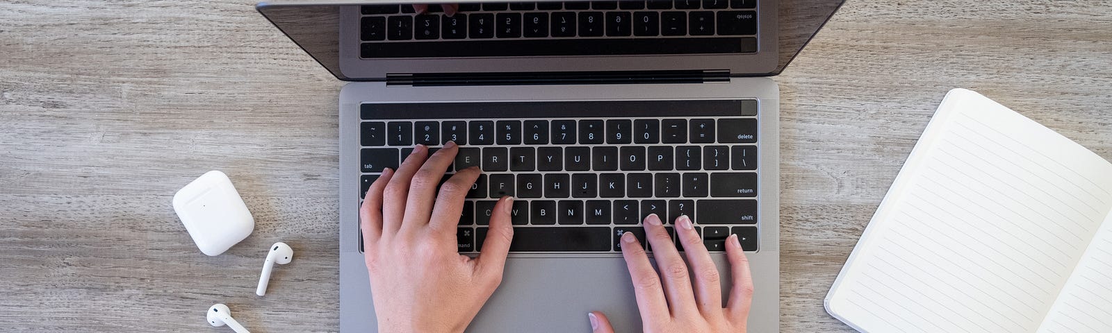 Hands typing on a laptop keyboard representing starting an online business