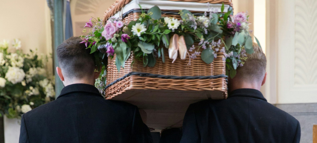 men carrying a casket