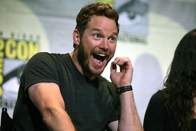 Actor Chris Pratt in a black T-shirt speaking at Comic Con, San Diego, in 2016 about his film Guardians of the Galaxy Vol 2