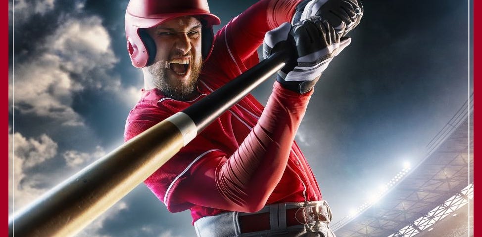Baseball hitter in red jersey swinging bat