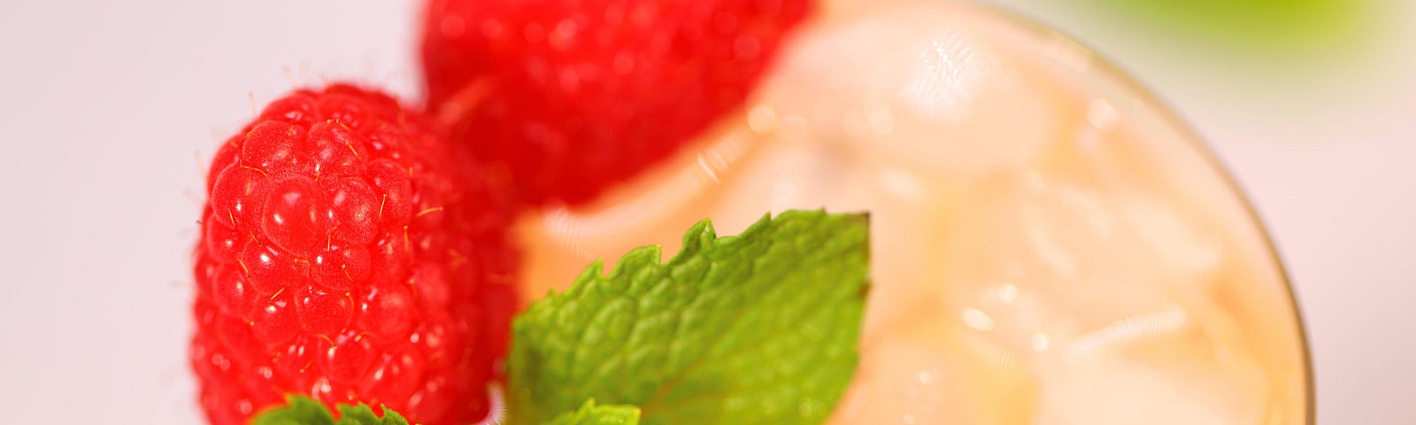 Summer Bliss: Green Tea Lemonade topped with raspberries and fresh mint.