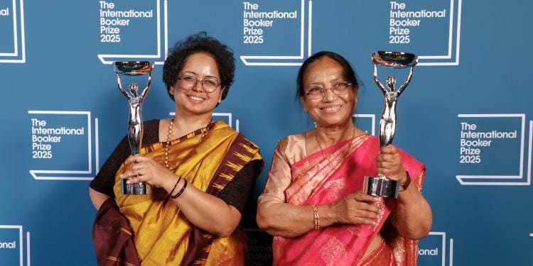 Color photo of Deepa Bhasthi and Banu Mushtaq at the IBP ceremony
