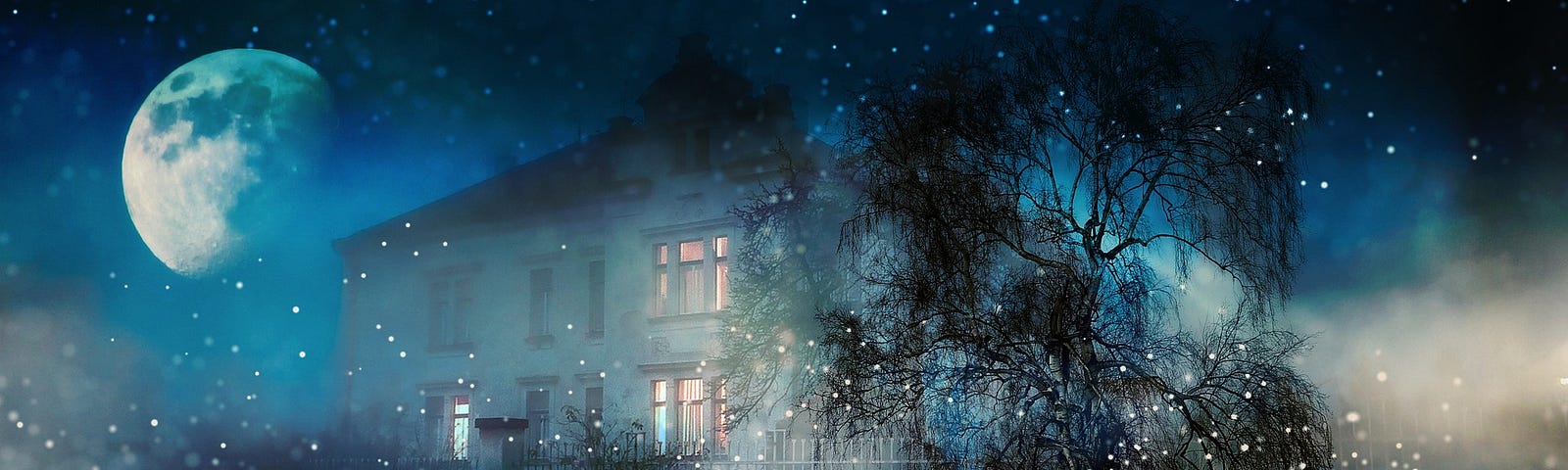 Large house at night when it is snowing