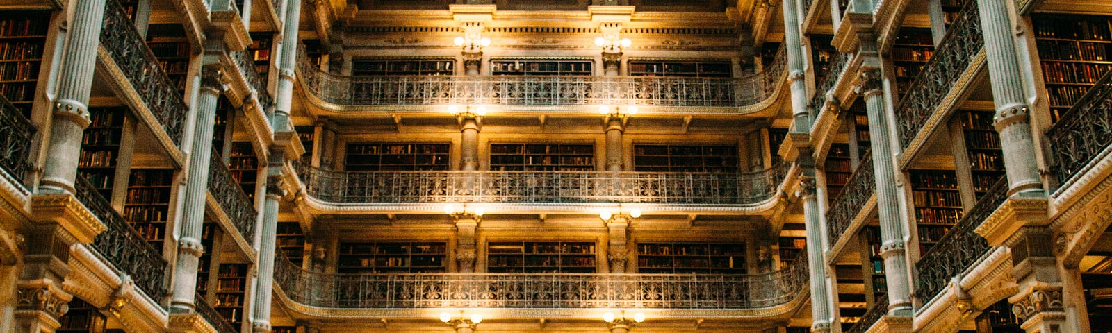 Man reading at George Peabody library Baltimore.