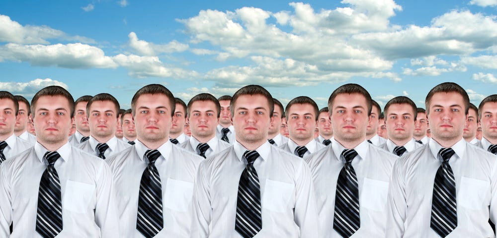 IMAGE: An army of many identical businessmen clones